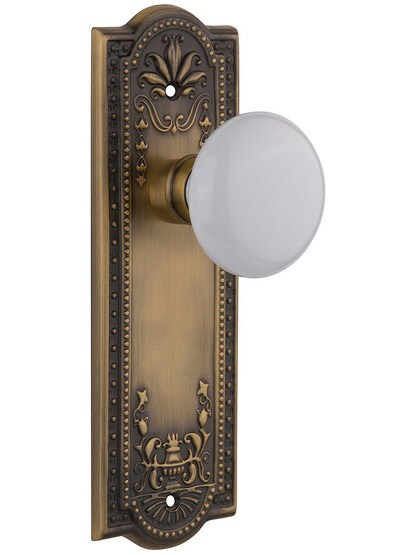 Meadows Style Door Set With White Porcelain Door Knobs Single Dummy in Antique Brass.